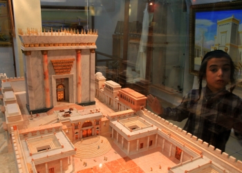 An ultra orthodox boy looks at a model of the third Temple on display at the Temple Institute in Jerusalem's Old City. The major focus of the Institute is its efforts towards the beginning of the  rebuilding of the Holy Temple.

The Temple in Jerusalem or Holy Temple refers to a series of structures located on the Temple Mount in the Old City of Jerusalem. Historically, two temples were built at this location, and a future Temple features in Jewish belief.  According to the Hebrew Bible, the First Temple was built by King Solomon. It was the center of ancient Judaism according to Hebrew scripture and the sole place of Jewish sacrifice. The first Temple was destroyed by the Babylonians in 586 BCE and the Second was built 5 centuries later, but destroyed already in 70 CE. All of the outer walls still stand today, although the Temple itself has long since been destroyed, and for many years it was believed that the western wall of the complex was the only wall standing.

An Islamic shrine, the Dome of the Rock, has stood on the site of the Temple since the late 7th Century CE, and the al-Aqsa Mosque, from roughly the same period, also stands on the Temple courtyard. Jewish belief envisions the construction of The Third Temple in Jerusalem associated with the coming of the Jewish Messiah, and thus, followers of Orthodox Judaism anticipate a Third Temple. August 11, 2009. Photo by Nati Shohat/FLASH90
 *** Local Caption *** ??? ?????
??? ?????
???? ?????

???? ????
???????
???