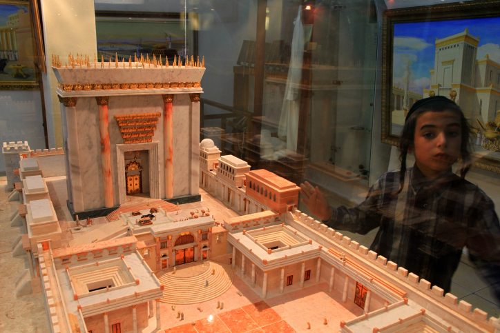 An ultra orthodox boy looks at a model of the third Temple on display at the Temple Institute in Jerusalem's Old City. The major focus of the Institute is its efforts towards the beginning of the  rebuilding of the Holy Temple.

The Temple in Jerusalem or Holy Temple refers to a series of structures located on the Temple Mount in the Old City of Jerusalem. Historically, two temples were built at this location, and a future Temple features in Jewish belief.  According to the Hebrew Bible, the First Temple was built by King Solomon. It was the center of ancient Judaism according to Hebrew scripture and the sole place of Jewish sacrifice. The first Temple was destroyed by the Babylonians in 586 BCE and the Second was built 5 centuries later, but destroyed already in 70 CE. All of the outer walls still stand today, although the Temple itself has long since been destroyed, and for many years it was believed that the western wall of the complex was the only wall standing.

An Islamic shrine, the Dome of the Rock, has stood on the site of the Temple since the late 7th Century CE, and the al-Aqsa Mosque, from roughly the same period, also stands on the Temple courtyard. Jewish belief envisions the construction of The Third Temple in Jerusalem associated with the coming of the Jewish Messiah, and thus, followers of Orthodox Judaism anticipate a Third Temple. August 11, 2009. Photo by Nati Shohat/FLASH90
 *** Local Caption *** ??? ?????
??? ?????
???? ?????

???? ????
???????
???