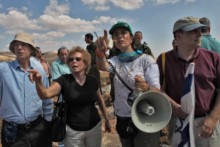 Activist Nadia Matar leads a tour attended by a group of Jews in the settlement of Bnei Adam and nearby West Bank settlements. Matar believes that the Land of Israel including the West Bank and Gaza was promised and belongs to the Jewish People, according to the Torah. She fights for the right of all Jews to live and flourish throughout the West Bank. September 23, 2009. Photo by Nati Shohat/FLASH90



Israeli soldiers stand guard at the Jewish settlement of Bnei Adam, where a group of Jews attended a tour led by activist Nadia Matar (not seen) in the Jewish settlements of the West Bank. September 23, 2009. Photo by Nati Shohat/FLASH90 *** Local Caption *** ??? ???
???? ???
???
????
???? ?????
????????
???????
??????
??????
????