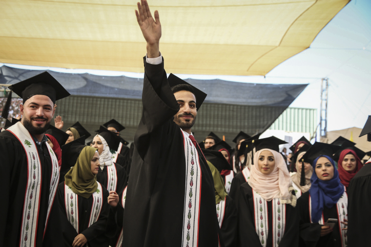 Palestinian students raise their diploma during their graduation ceremony at the end of the academic year on May 20, 2016 at Birzeit University in the West Bank town of Birzeit, near Ramallah. Photo by Flash90
 *** Local Caption *** ??? ???
???? ???????
??????????
??? ????
??????
??????
??????
????????
????????