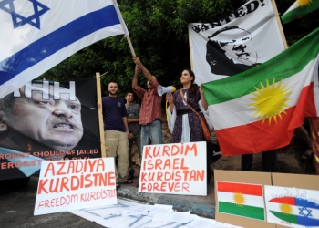 Israelis hold up placards, including a portrait of Turkey's Prime Minister Recep Tayyip Erdogan' labeled wanted, during an anti-Turkish protest outside the Turkish embassy in Tel Aviv on July 08, 2010. Protesters waved Kurd flags and chanted slogans in favor of the Kurd people and against, what they call, their depression by Turkey. Photo by Gili Yaari / Flash 90. *** Local Caption *** ???? ??????
????? ??? ??????? ??????
??????
??? ?????
??????
??? ?????
??? ??????
??? ??????