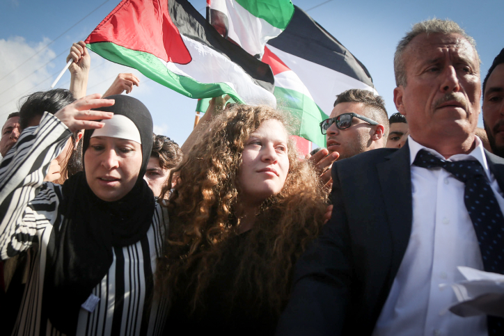 Palestinian teenager Ahed Tamimi is welcomed by relatives and supporters after she was released from Ofer prison on July 29, 2018. 17-year old Tamimi had served an eight-month sentence for slapping and shoving IDF soldiers outside her home in the West Bank village of Nebi Saleh late last year. Photo by FLASH90 *** Local Caption *** ??? ?????
