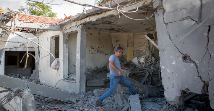 A man walks outside a house that was hit by a rocket fired from the Gaza Strip in the southern Israeli city of Ashkelon, on November 13, 2018. Photo by Nati Shohat/Flash90 *** Local Caption ***  ???
?????
????
????
???
????? ???
????
??????