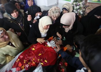 Relatives react next to the body of a Palestinian who allegedly carried out attacks against Israelis, after his body was released by Israel, during his funeral in Silwad near the West Bank city of Ramallah January 3, 2016. Photo by Flash90
 *** Local Caption *** ?????
??????
????????
????
?????????
??
????
???????
????
????
????
?????
????????
?????