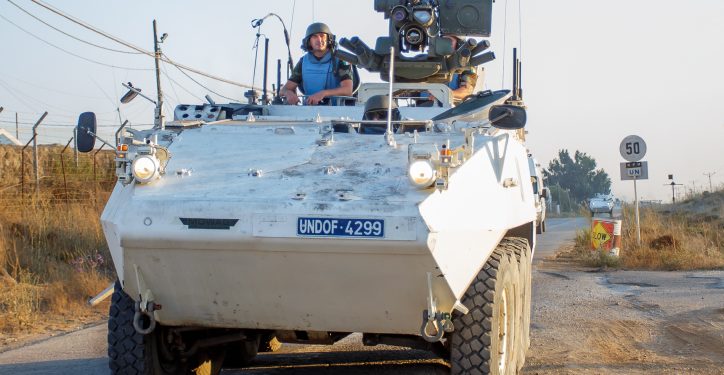 Members of the United Nations Disengagement Observer Force (UNDOF) stand on an armoured vehicle driving in the Israeli-annexed Golan Heights near the Quneitra crossing between Israel and Syria, on August 30, 2014. UN peacekeepers caught up in heavy fighting on the Golan Heights were evacuated while many of their colleagues have been captured by Syrian rebels. Photo by Flash90 *** Local Caption *** ??? ?????
?????
?????
????
???? ????????
?????
??????
????
?????
??"?
???? ??"?