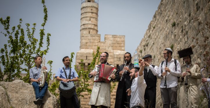 Jewish men play klezmer music as they walk next to the walls of the Jerusalem's Old City, during the Passover holiday, on April 25, 2019. Photo by Yonatan Sindel/Flash90 *** Local Caption *** ????????, ???????, ???
??????
?????
????
 ?????? ???????? ?? ?? ??? ?????? ????? ???? ???? ?????? ???? ??? ???? ??? ??? ???? ??? ???? ???? ??? ????? ???? ??????. ??????? ????????? ?????? ???? ???????