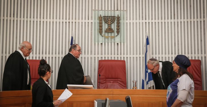 Judges, Eliyakim Rubinstein, Hanan Meltzer, and Nil Hendel, enter the room at the Jerusalem Supreme Court, before hearing the State's answer to Palestinian prisoner, Muhammed Allaan's petition to be released. Allaan, a prisoner held without trial, has been on hunger strike for almost two months and is in critical condition. August 17, 2015. Photo by Hadas Parush/Flash90 *** Local Caption *** ????? ????
???? ??????
????
???????
???? ???
???? ???
????? ??????
??"?
?????
??? ????? ??????
???????
????? ???
????? ?????
??????
????
?????? ??????????
??? ????
??? ????