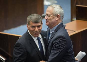 Blue and White party member Gabi Ashkenazi is greeted by party chairman Benny Gantz at the Plenary Hall at the Knesset, Israel's Parliament, in Jerusalem, on May 14, 2019. Photo by Hadas Parush/Flash90