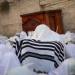 Jewish worshippers cover themselves with prayer shawls as they pray in front of the Western Wall, Judaism's holiest prayer site, in Jerusalem's Old City, during the Cohen Benediction priestly blessing at the Jewish holiday of Sukkot, October 8, 2017. Photo by Yonatan Sindel/Flash90 
 *** Local Caption *** ???
??
?????
?????
????
??????
???? ????? ??????
???? ??????
?? ?????