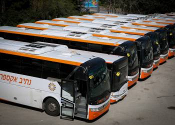 Public buses parked at a parking lot in Tzfat. The daily Israeli life has largely shut down with more cases of people being infected by the Coronavirus. April 03, 2020. Photo by David Cohen/Flash90 *** Local Caption *** ??????
?????
???????
??????
???