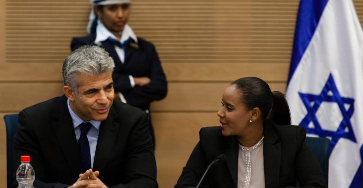 Israel's Minister of Finance Yair Lapid (L) with Yesh Atid  parliament member Pnina Tamano-Shata during a conference of parliament members lobbying for Ethiopian Jews in Israel at the Israeli parliament (Knesset) on October 30, 2013. Photo by Flash90 *** Local Caption *** ???? ?????? ?????? ????? ??????? ?????? ????? ?????
????? ??? ?????? ???? ????? ????? ???? ???
?? ????? ???? ????