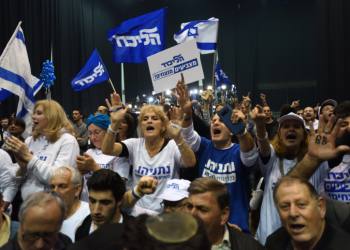Supporters of Israeli Prime Minister Benjamin Netanyahu celebrate after the release of exit polls results of the Israeli general election, at the party headquarters in Tel Aviv, on March 2'nd, 2020. Photo by Gili Yaari /Flash90 *** Local Caption *** ?????? ??????
??? ??????
?????? ?????
?????? 2020
???? ??????
????? ??????
???? ??????