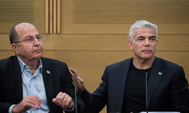 Blue and White party co-chairman Yair Lapid with MK Moshe Yaalon at a faction meeting at the Knesset, the Israeli parliament in Jerusalem, on June 24, 2019. Photo by Yonatan Sindel/Flash90