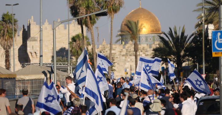 Jewish men dance with Israeli flags during the annual March of Flags near Jerusalem's Old City, June 15, 2021. Photo by Yonatan Sindel/Flash90 *** Local Caption *** ???? ??? ??????? ??? ??????
?????
???? ??????
???????