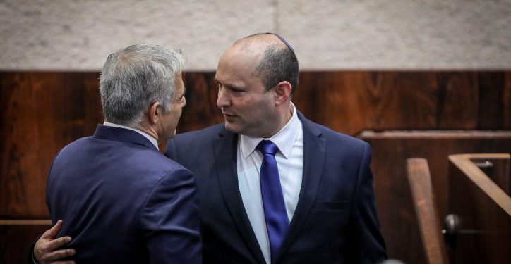 Head of the Yamin party Naftali Bennett and head of the Yash Atid party Yair Lapid seen during the Swearing in of the new Israeli government, at the Knesset, the Israeli parliament in Jerusalem on June 13, 2021. Photo by Olivier Fitoussi/Flash90 *** Local Caption *** ?????
???? 
?????
????
???? ????
????? ???
????