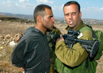 An Israeli army officer stand with a handcuffed palestinian man that was arrested during clashes on a Olives harvest close to Havat Gilad on October Wednesday  25. 2006.
Photo by Olivier Fitoussi /Flash90. *** Local Caption *** ???? ????
???? ?????
????? ??????? ????? ???? ??? ???
??? ?????
???? ????? ????
???? ??? ??????? 
?????
??????? ???????
????????
???????
????????
????????
?????????
????????
????????? 
???? ????
??? ???? 
??"? 
??"?