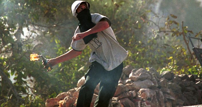 A Palestinian youth hurls a  molotov coctail towards Israeli soldiers standing on the top of Rachel's tomb in Bethlehem during clashes on  October 4, 2000.
Photo by Yossi Zamir / Flash90. *** Local Caption *** ???????
????????
????? ?????
???????
???"?
????
?????
??
????
??? ???
??? ??? ???????
????????
???????
????????
????????
?????????
????????
?????????