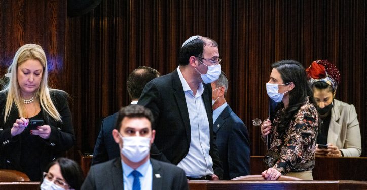 Interior Minister Ayelet Shaked speaks with MK Simcha Rotman at the plenum hall of the Knesset, the Israeli parliament in Jerusalem on February 16, 2022.  Photo by Olivier Fitoussi/Flash90 *** Local Caption *** ?????
????
???
?????
???
??? ?????
???? ?????
??? ???????