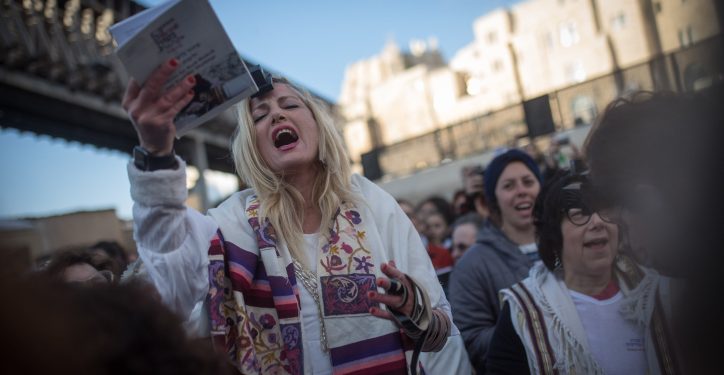 Members of the Women of the Wall movement hold Rosh Hodesh prayers as thousands of ultra-Orthodox women protest against them at the Western Wall in Jerusalem Old City, March 8, 2019. Photo by Hadas Parush/Flash90  *** Local Caption *** ???????
????????????
??????
?????? ????????
???? ?????
?????
????? ????
???? ????????
????? ??????
??? ?????
???????
????? ?????????